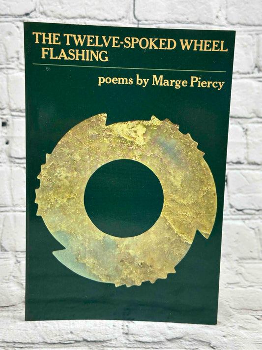 The twelve spoked wheel flashing : poems
