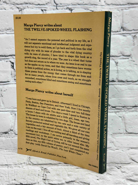 The twelve spoked wheel flashing : poems