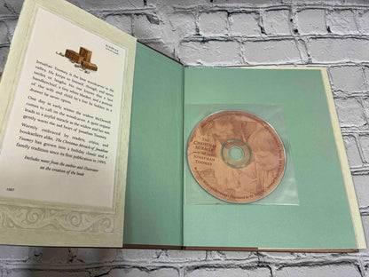 The Christmas Miracle of Jonathan Toomey by Susan Wojciechowski, hardcover with CD - storytime CD in front pastedown sleeve