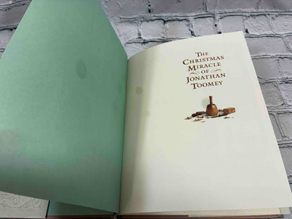 The Christmas Miracle of Jonathan Toomey by Susan Wojciechowski, hardcover with CD - half-title page