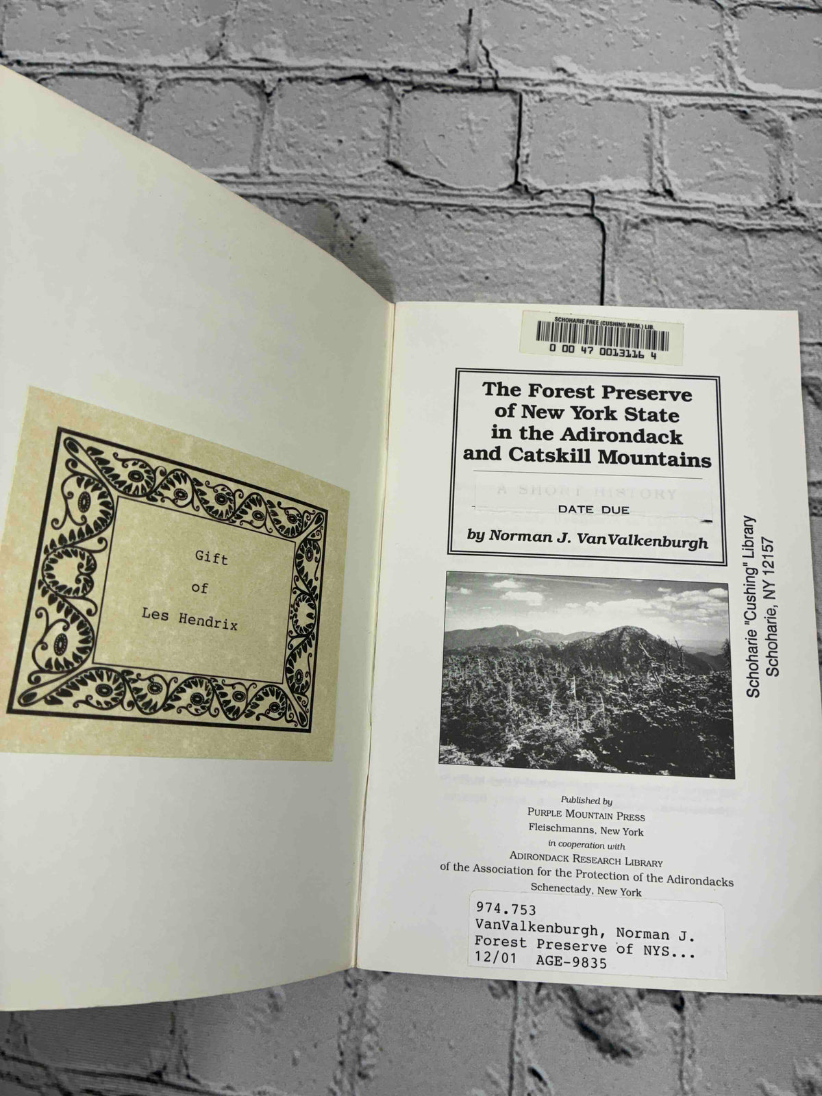 The Forest Preserve of New York State in the Adirondack and Catskill Mountains by Norman J. VanValkenburgh, 1996 Purple Mountain Press paperback - Gift of Les Hendrix bookplate and title page with library labels