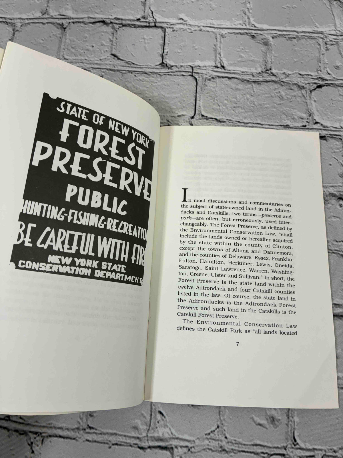 The Forest Preserve of New York State in the Adirondack and Catskill Mountains by Norman J. VanValkenburgh, 1996 Purple Mountain Press paperback - Forest Preserve sign photo and first page of text