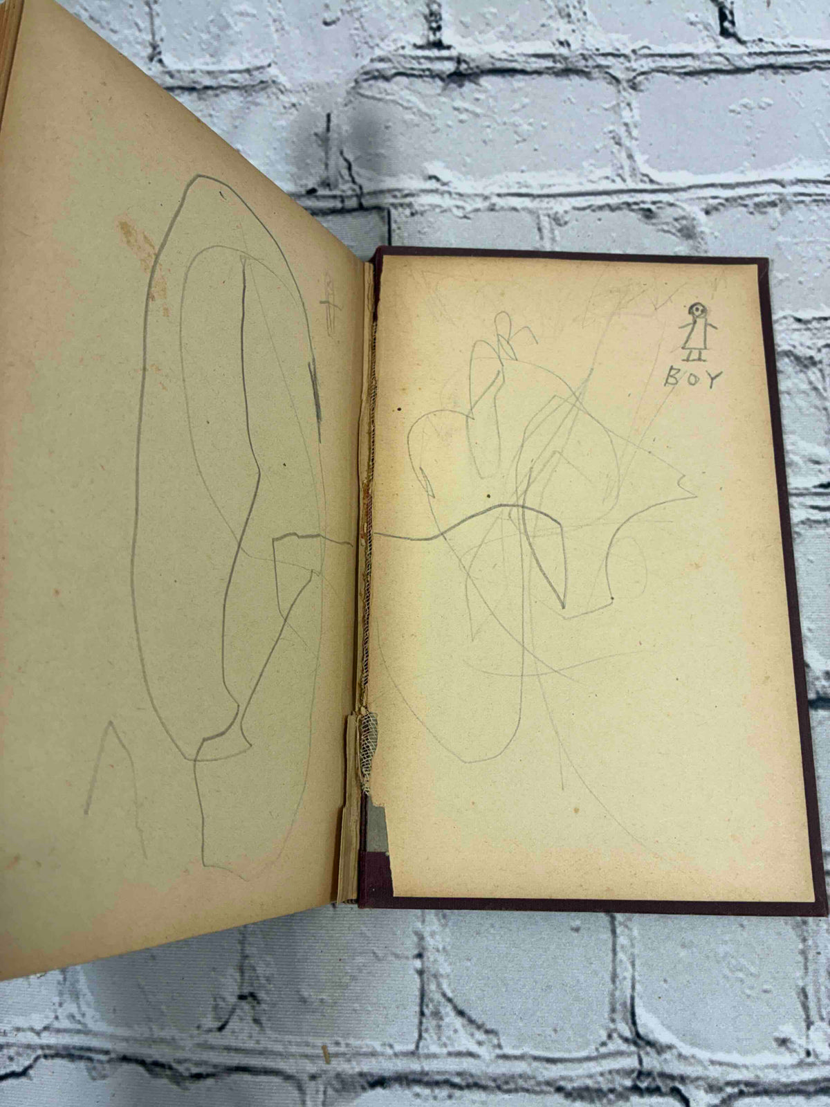 A Woman's War by Bertha M. Clay, Donohue Henneberry hardcover - pencil scribbles on rear endpapers and cracked rear hinge