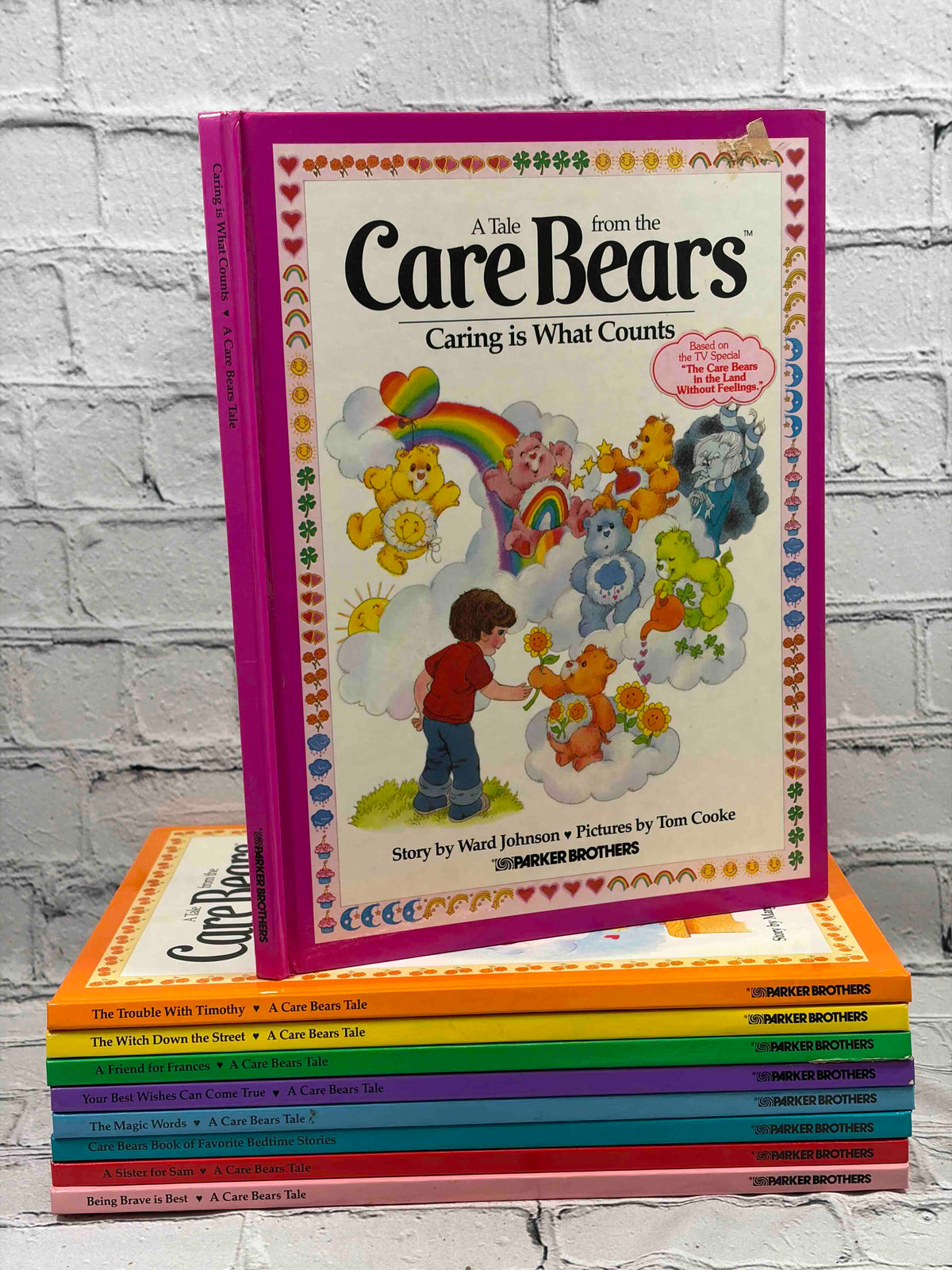 A Tale from the Care Bears lot of 9 hardcovers, Parker Brothers 1983-1984 - stack of all nine books with Caring is What Counts on top