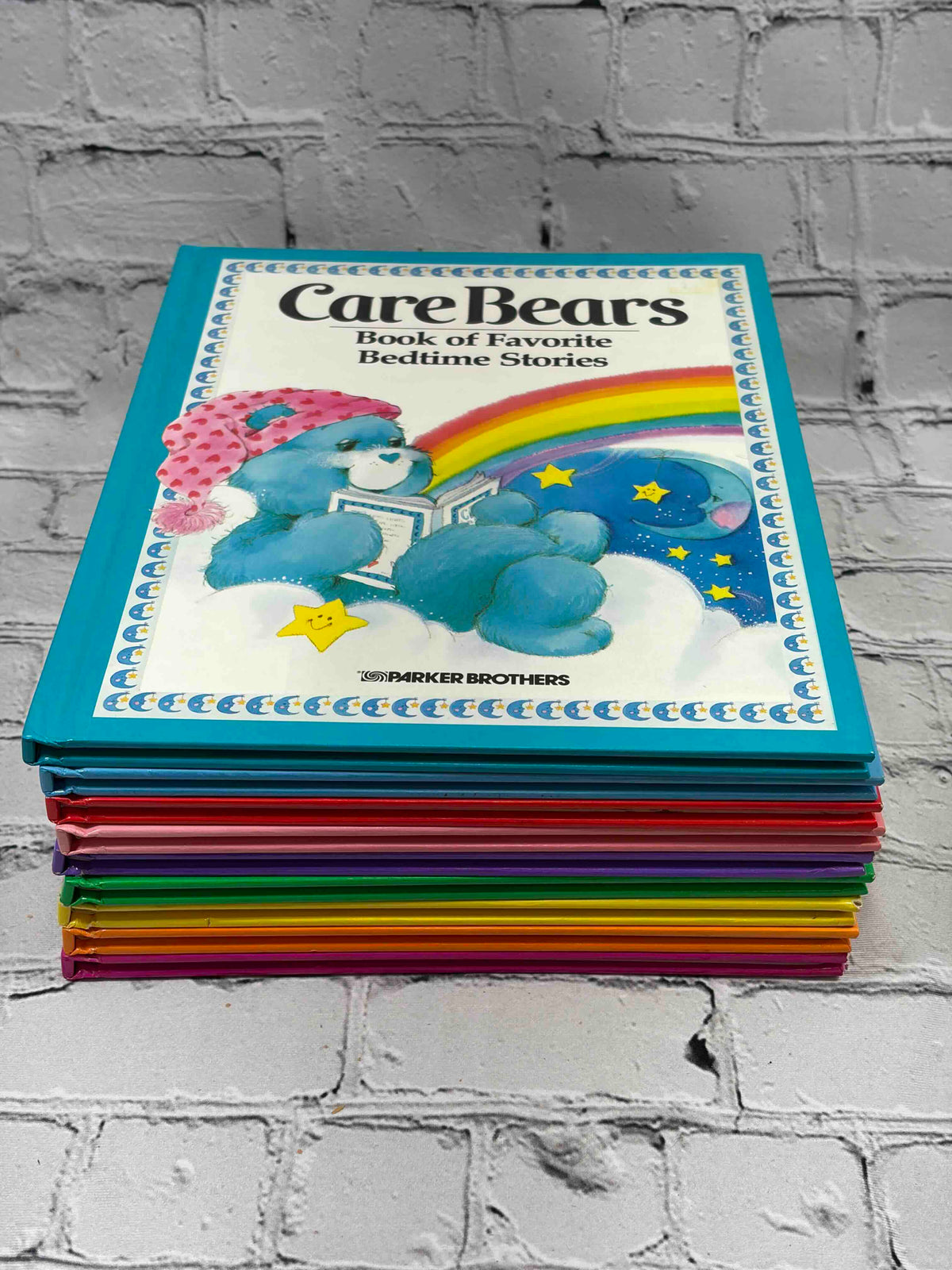 A Tale from the Care Bears lot of 9 hardcovers, Parker Brothers 1983-1984 - stack with Book of Favorite Bedtime Stories on top