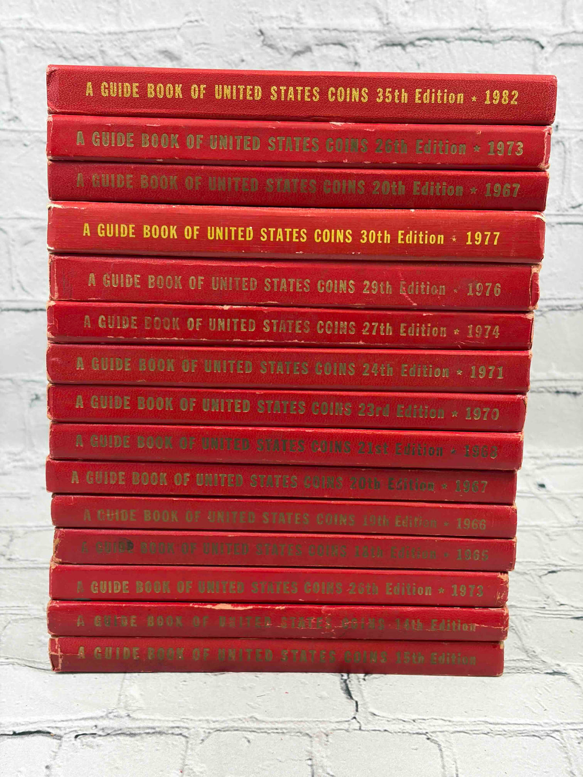 A Guide Book of United States Coins (Red Book) lot of 15 by R. S. Yeoman, 1961-1982 - spines of all 15 volumes