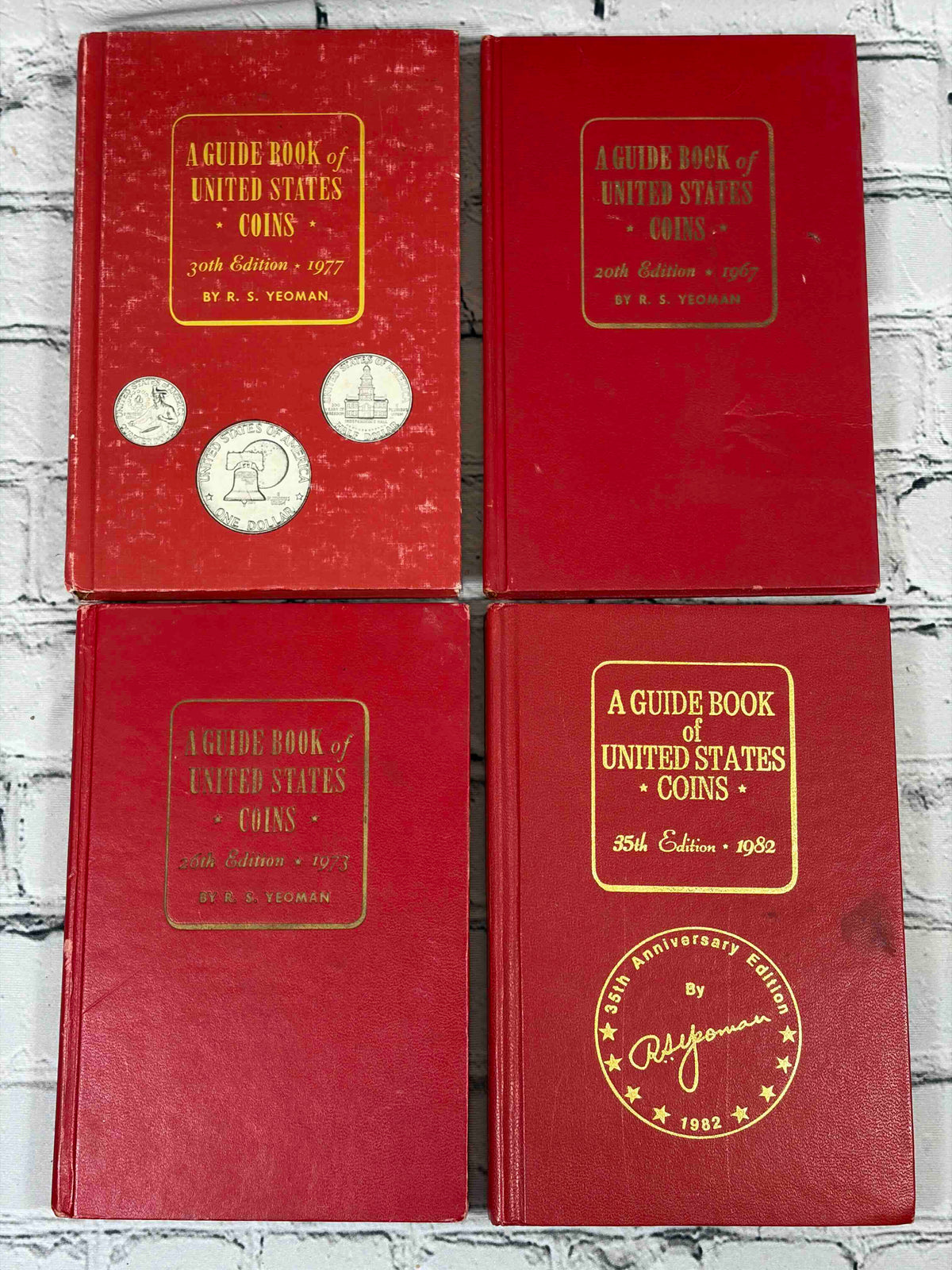 A Guide Book of United States Coins (Red Book) lot of 15 by R. S. Yeoman, 1961-1982 - front covers incl. 1977 and 1982 35th Anniversary editions