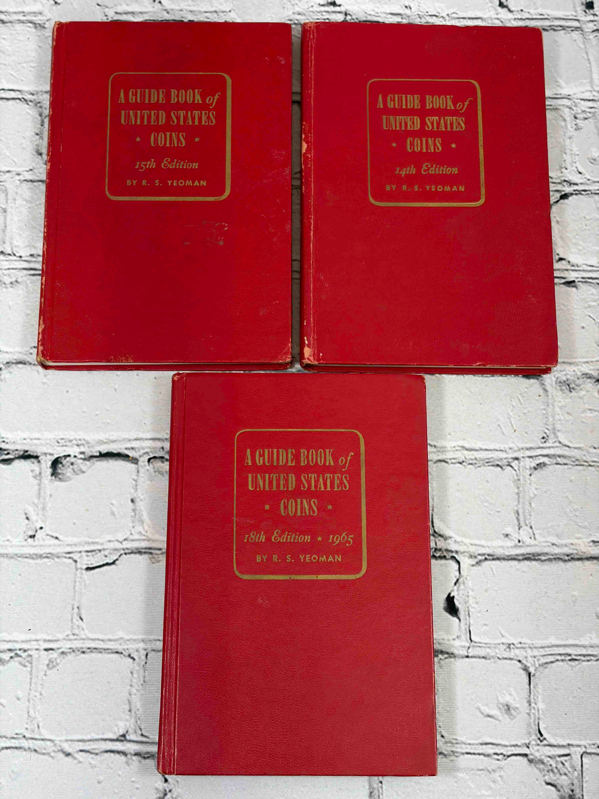 A Guide Book of United States Coins (Red Book) lot of 15 by R. S. Yeoman, 1961-1982 - front covers incl. 1965 18th edition