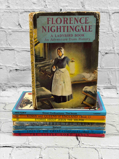 Lot of 8 vintage Ladybird books - stack showing spines