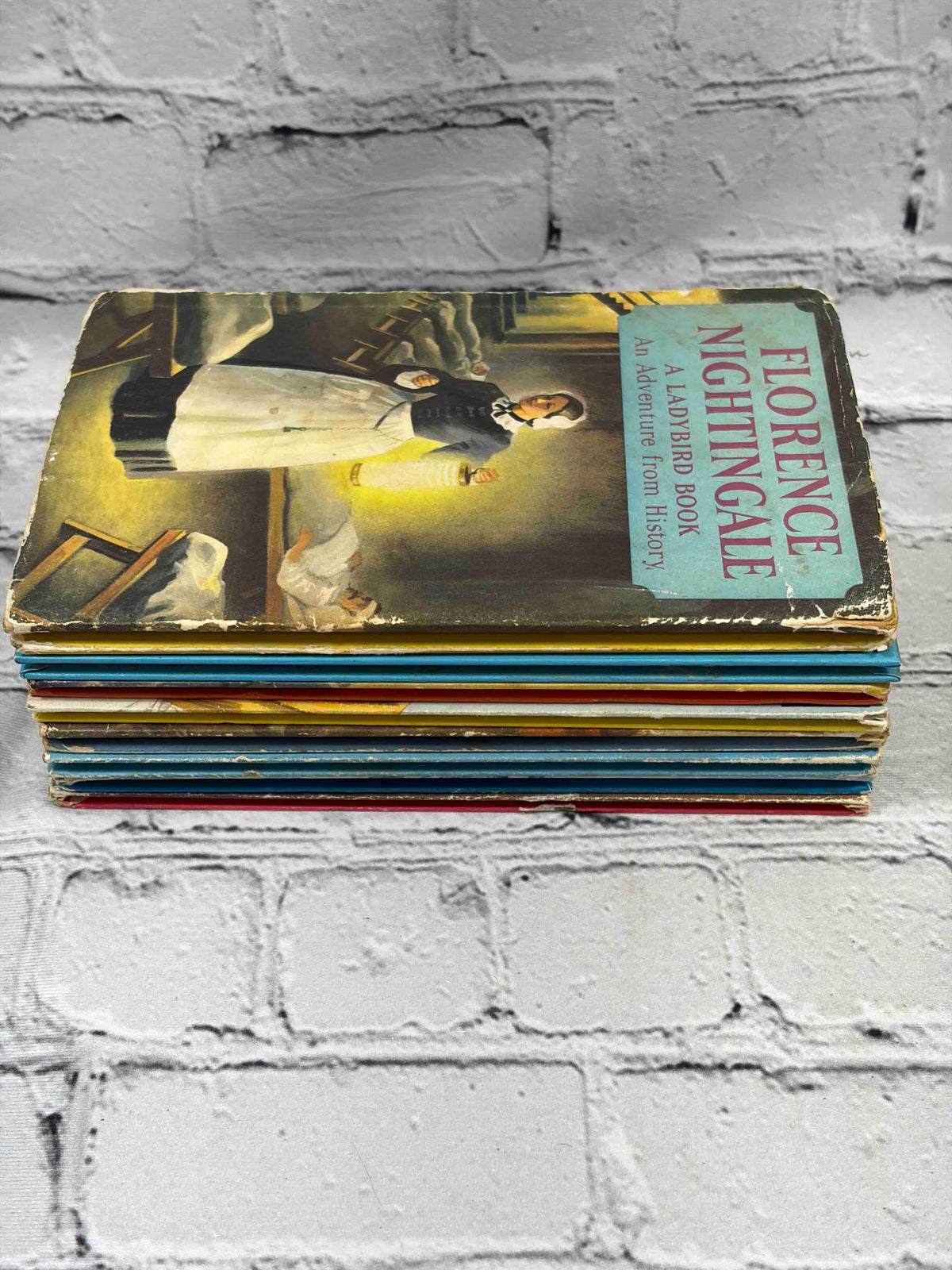 Lot of 8 vintage Ladybird books - stack side view