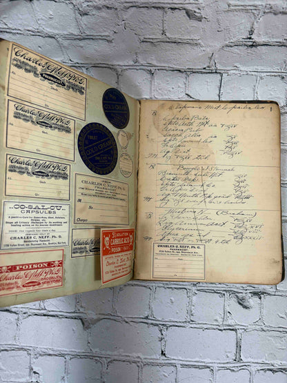 Pharmacist's handwritten formula book of Charles C. Neff, Ph.G., 1903-1906 - pasted-in Neff pharmacy labels and handwritten formulas