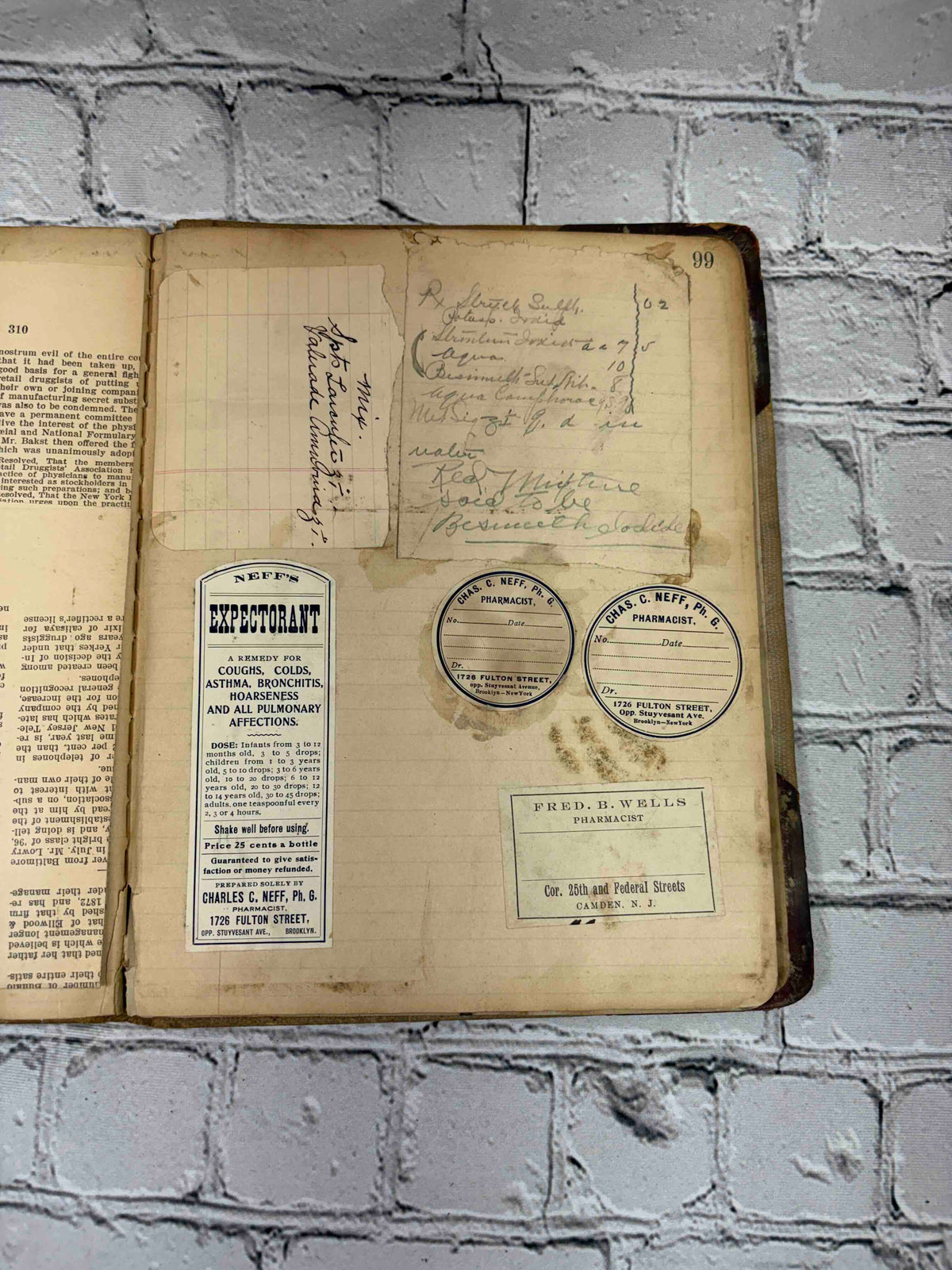 Pharmacist's handwritten formula book of Charles C. Neff, Ph.G., 1903-1906 - pasted-in labels and notes, page 99