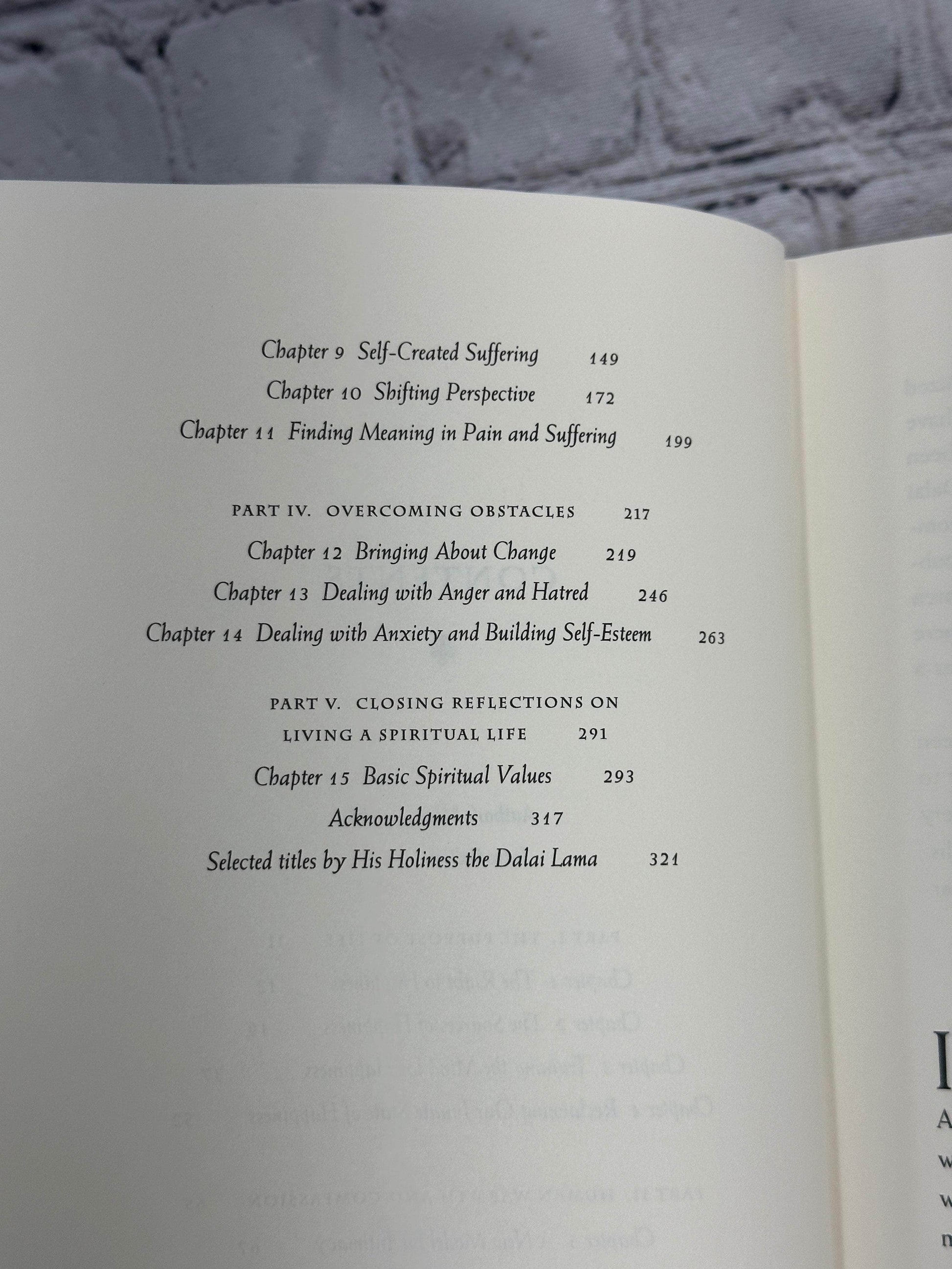 Flipped Pages The Art of Happiness A Handbook for Living by The Dalai Lamar [1998]