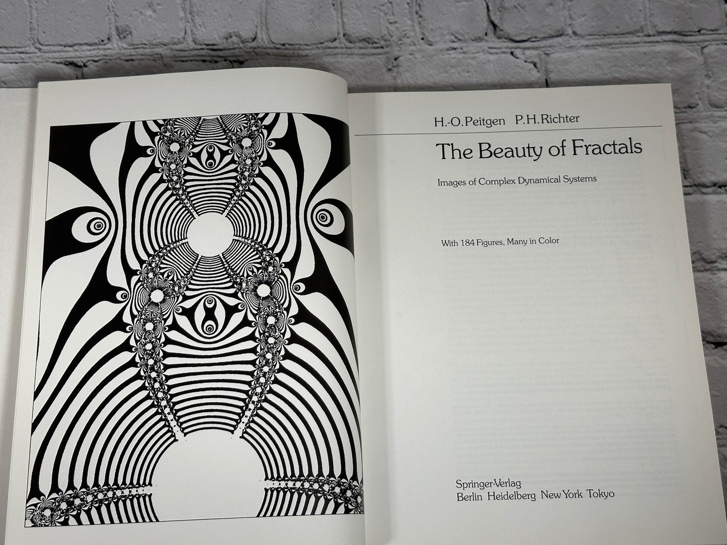 Flipped Pages The Beauty of Fractals by H.-O. Peitgen & P.H. Richter [1986]