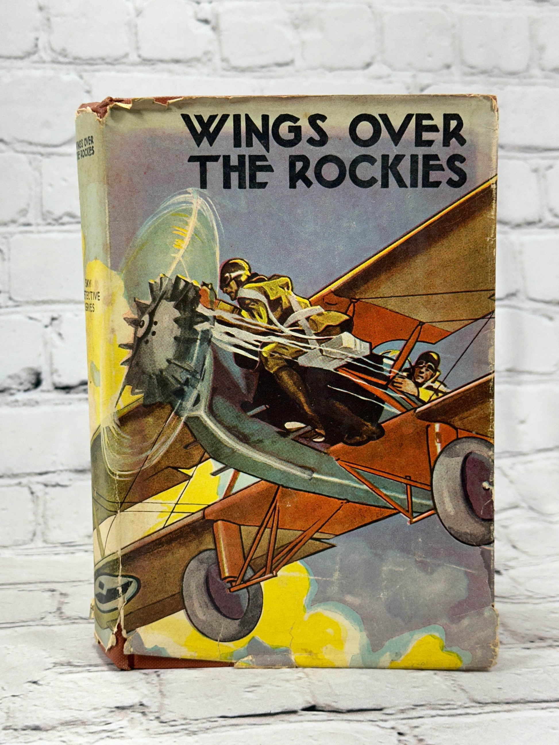 Flipped Pages Wings Over the Rockies  by Ambrose Newcomb [1930]