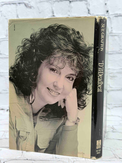 D Is for Deadbeat by Sue Grafton, 1987 Henry Holt hardcover - dust jacket rear and spine
