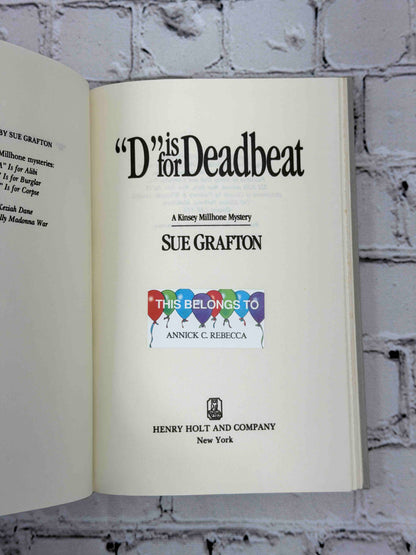 D Is for Deadbeat by Sue Grafton, 1987 Henry Holt hardcover - title page with owner sticker
